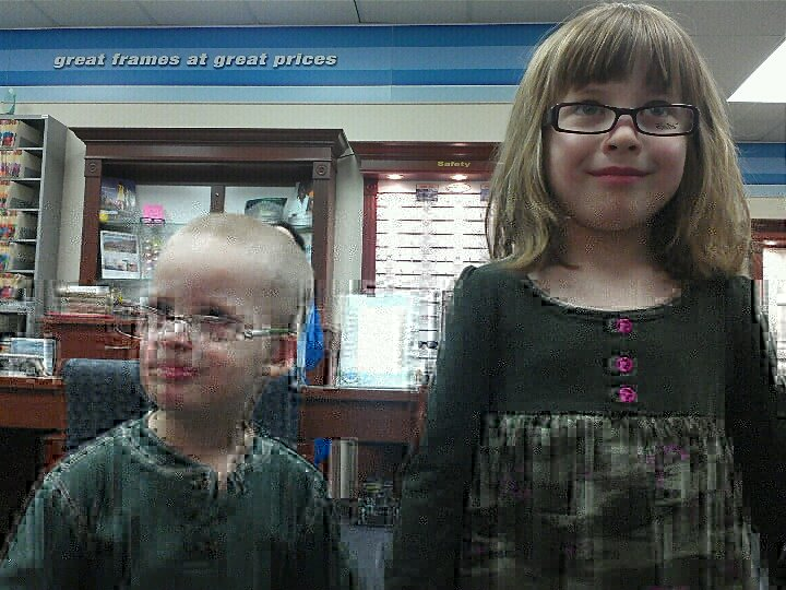 These are my cuties trying on Shana's new frames.  I love that John picked up a pair too and promptly put them on.  He's my empathetic one.  :)